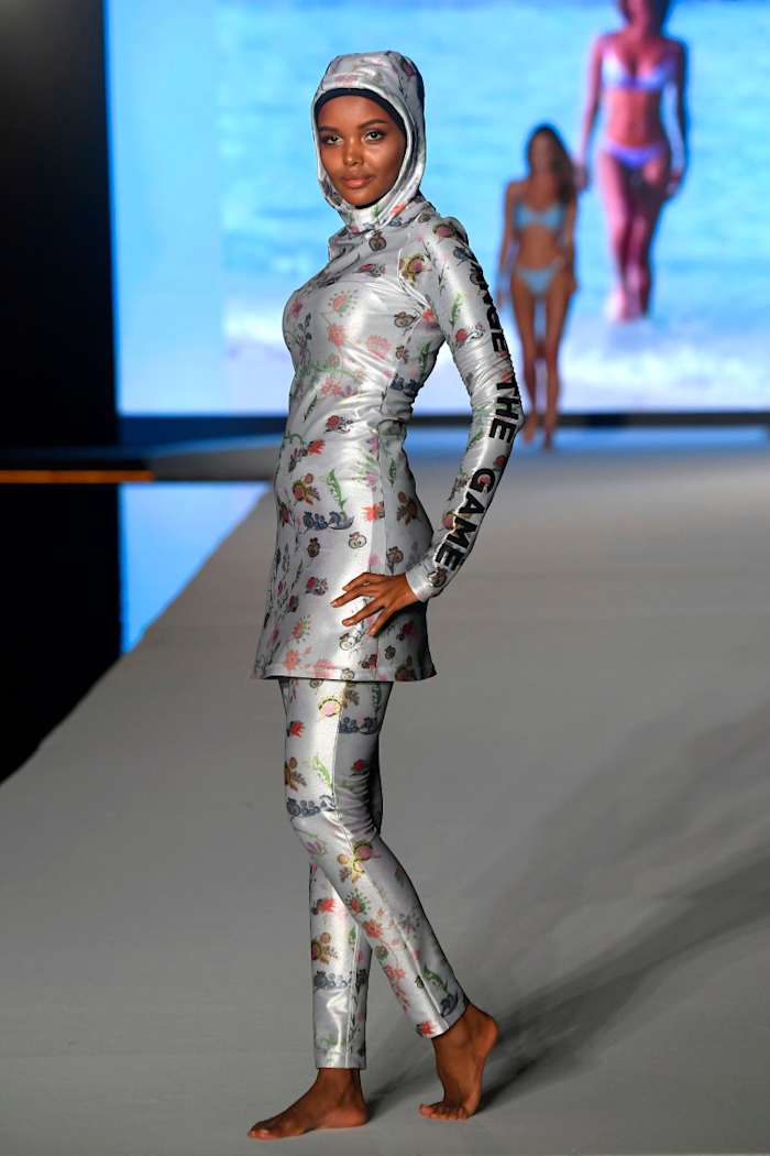 Halima Aden walks the runway during the 2019 Sports Illustrated Swimsuit Runway Show During Miami Swim Week At W South Beach - Runway at WET poolside lounge at W South Beach on July 14, 2019 in Miami Beach, Florida